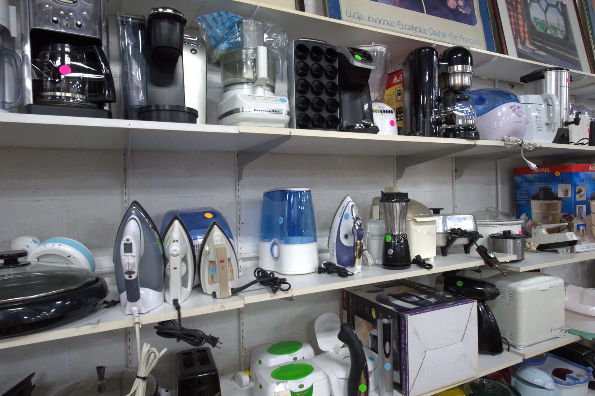 A store shelf filled with lots of different types of appliances