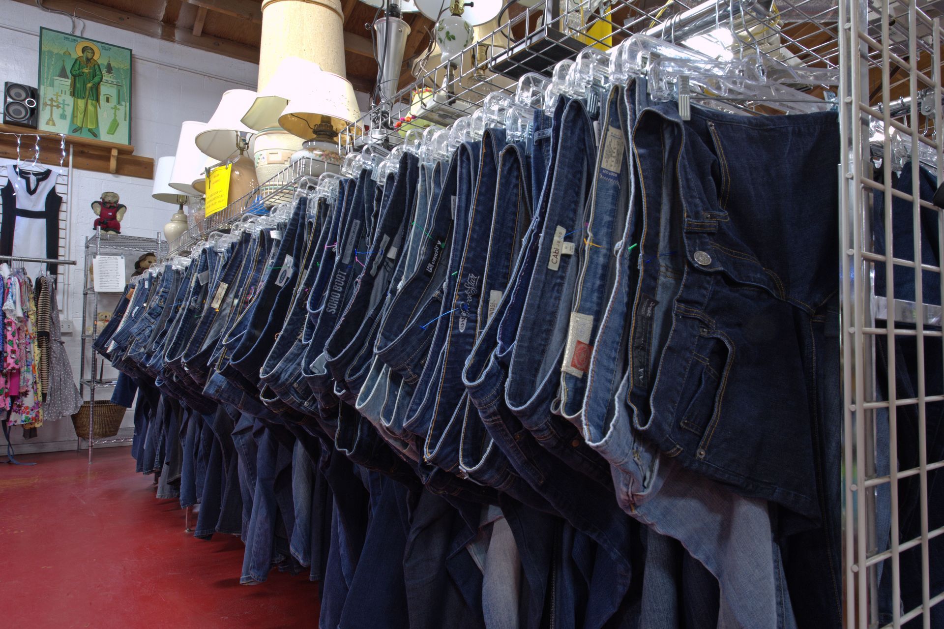 A row of jeans hanging on a rack in a store
