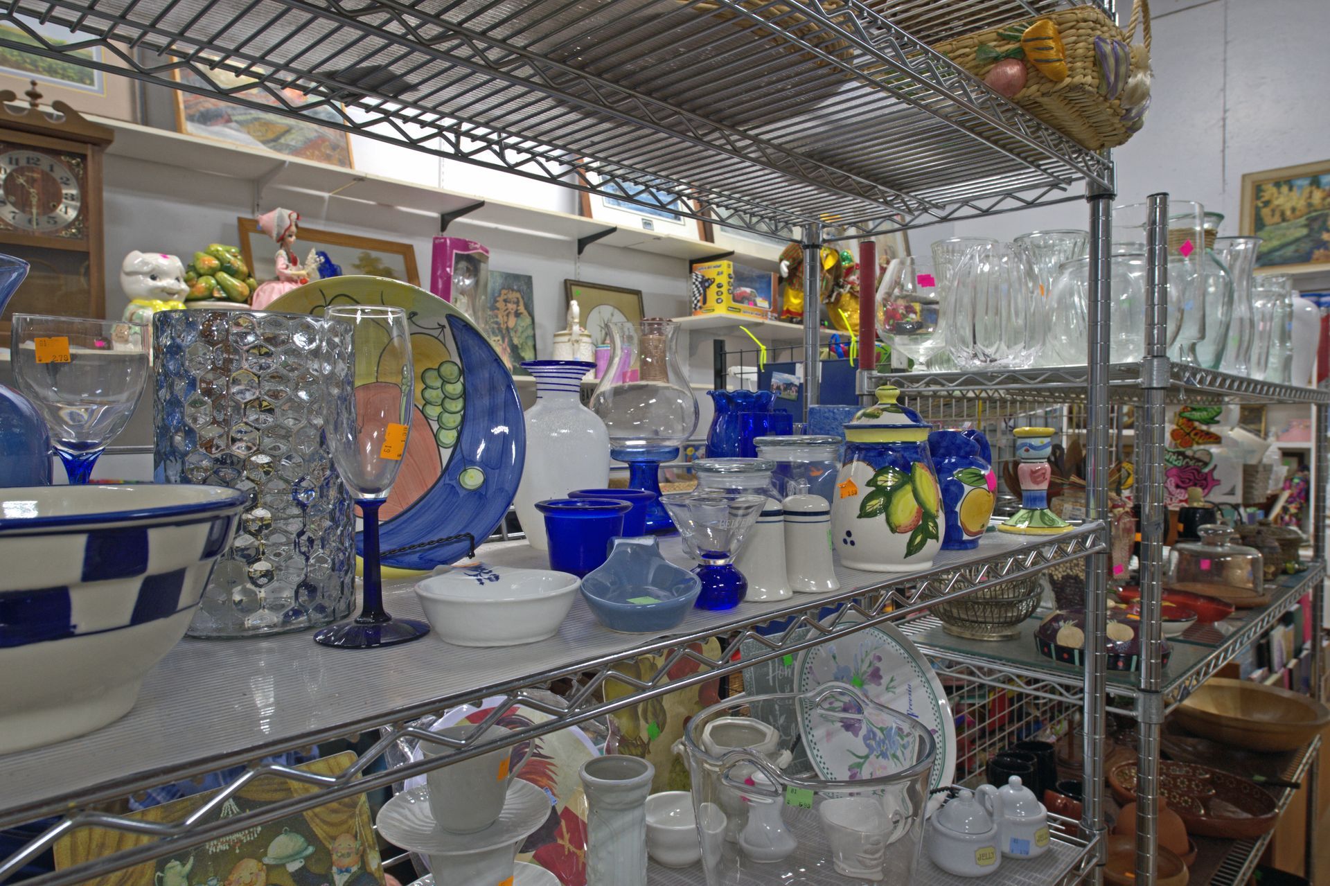 A store filled with lots of plates , bowls , glasses and vases.
