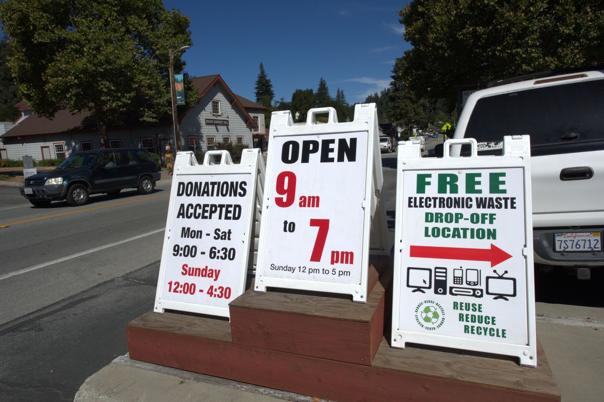 A sign that says open and free electronic waste drop-off location