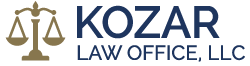 The logo for kozar law office , llc has a scale of justice on it.