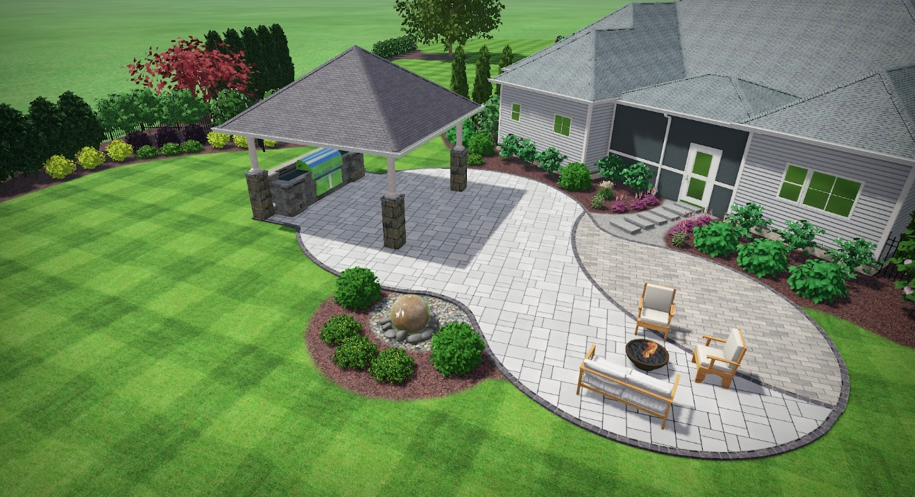 Landscaped garden bed with green shrubs, pink flowers, and black mulch in front of beige houses.