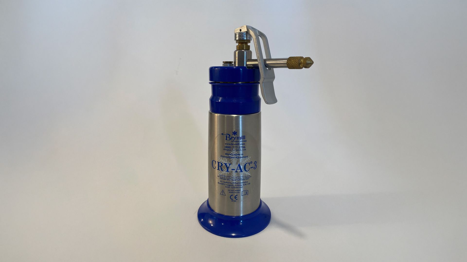 Silver and blue cryogenic storage container with a valve on a white surface.
