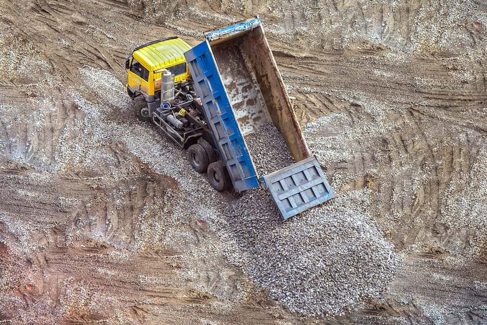 An Aerial View of a Dump Truck Loading Gravel on a Construction Site — Hardy's Excavations in Pottsville, NSW