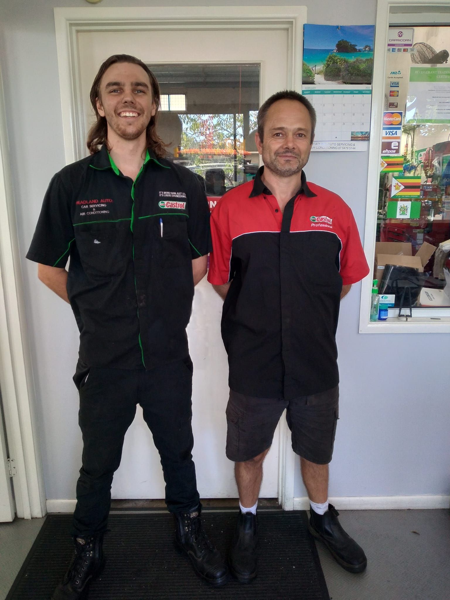 Two Men Standing In Front Of A Door In A Store — Headland Auto Servicing & Air Conditioning In Alexandra Headland, QLD