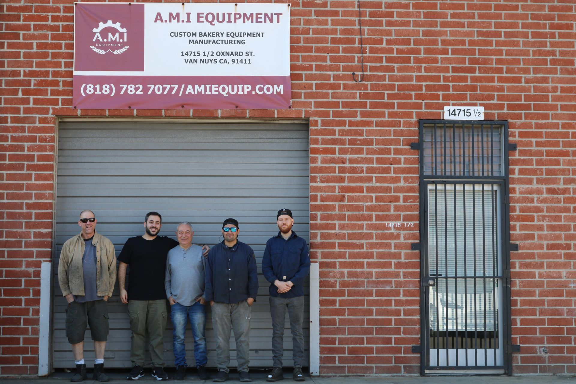 AMI Equipment team standing in front of AMI Equipment's building.