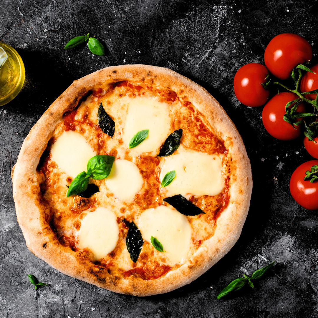 Italian Pizza Margherita with mozarella and basil leaves