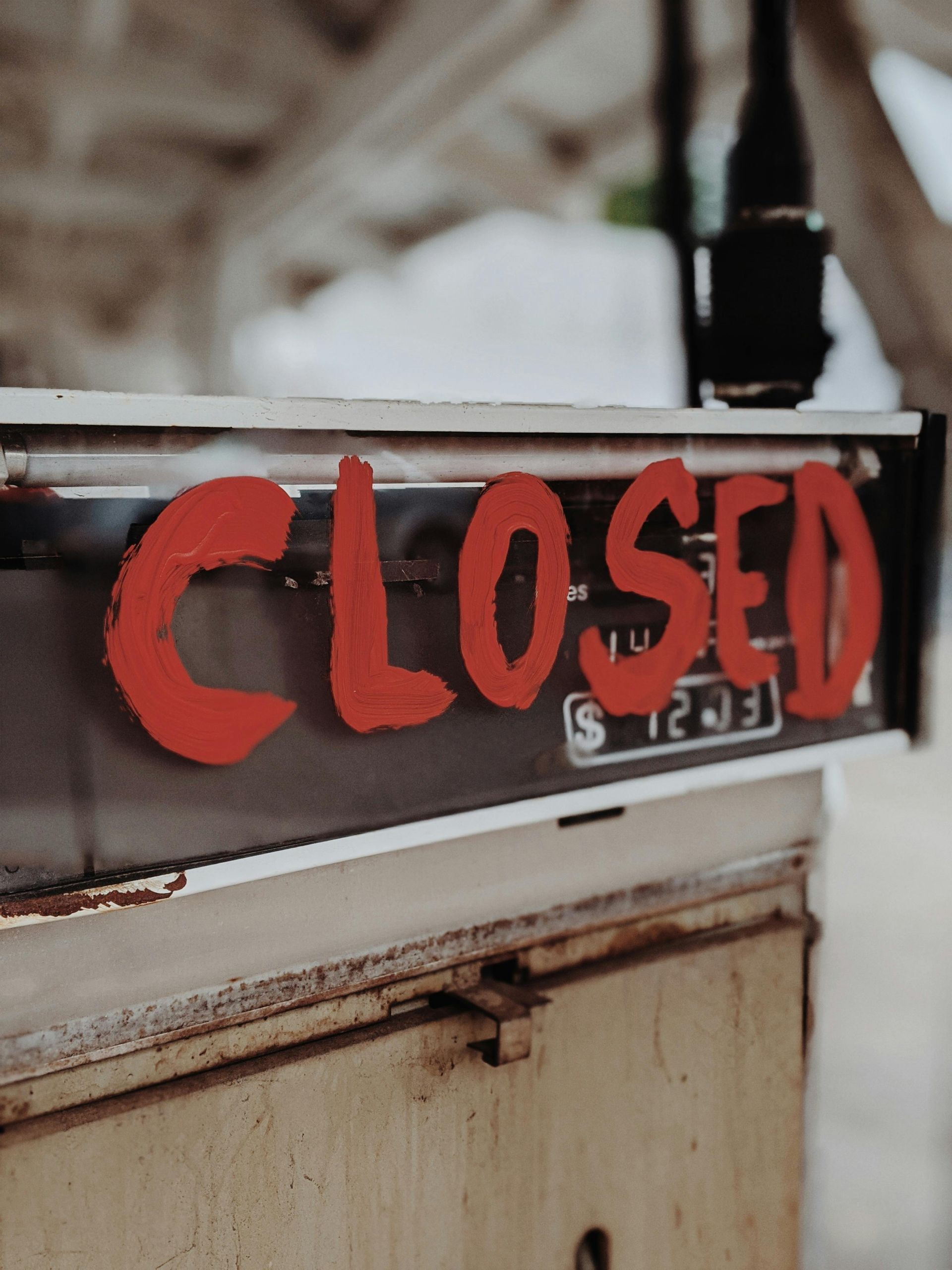 closed gas station sign