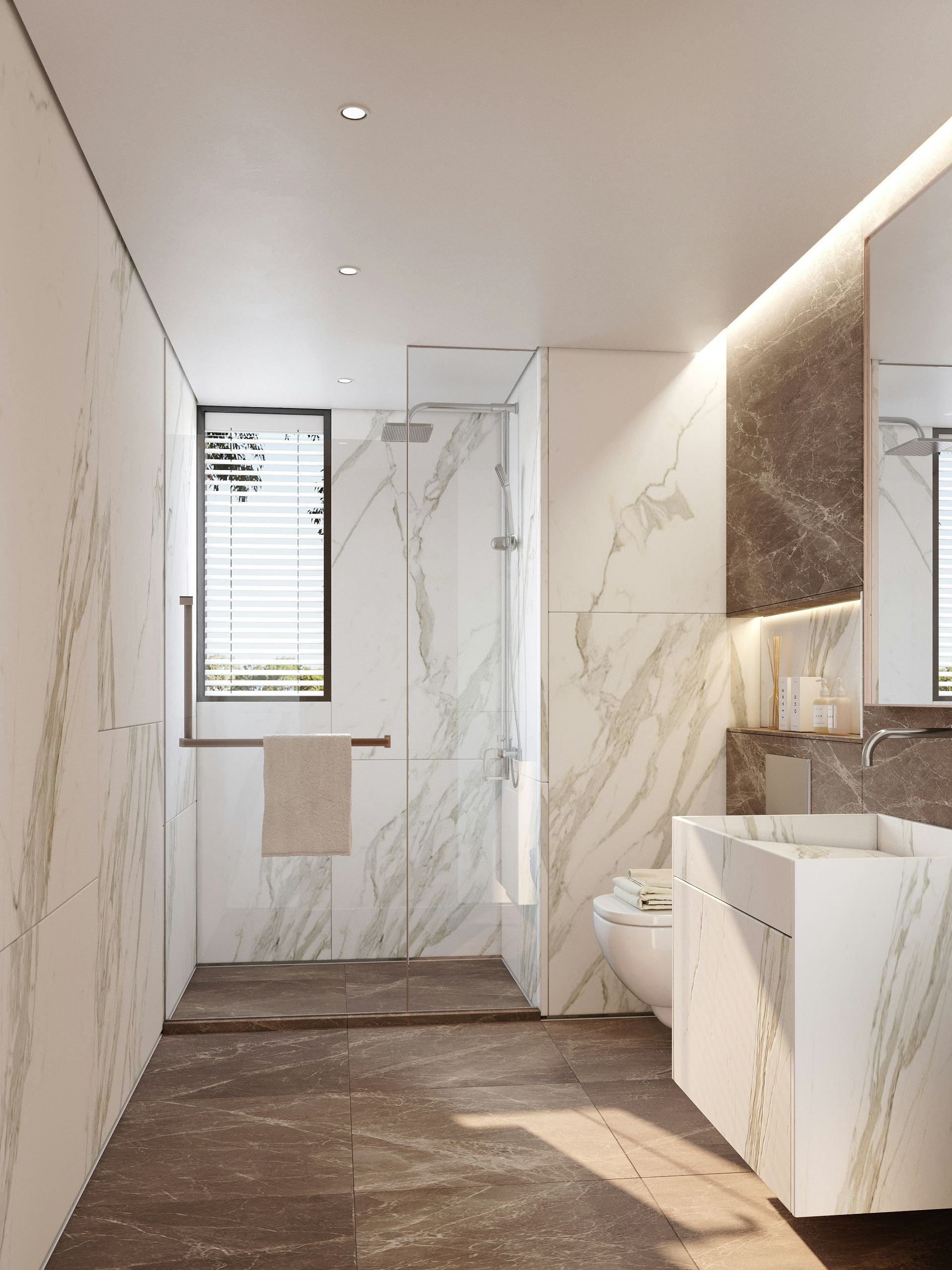 Modern bathroom with marble walls, shower, and stone sink. Brown floor, bright lighting.