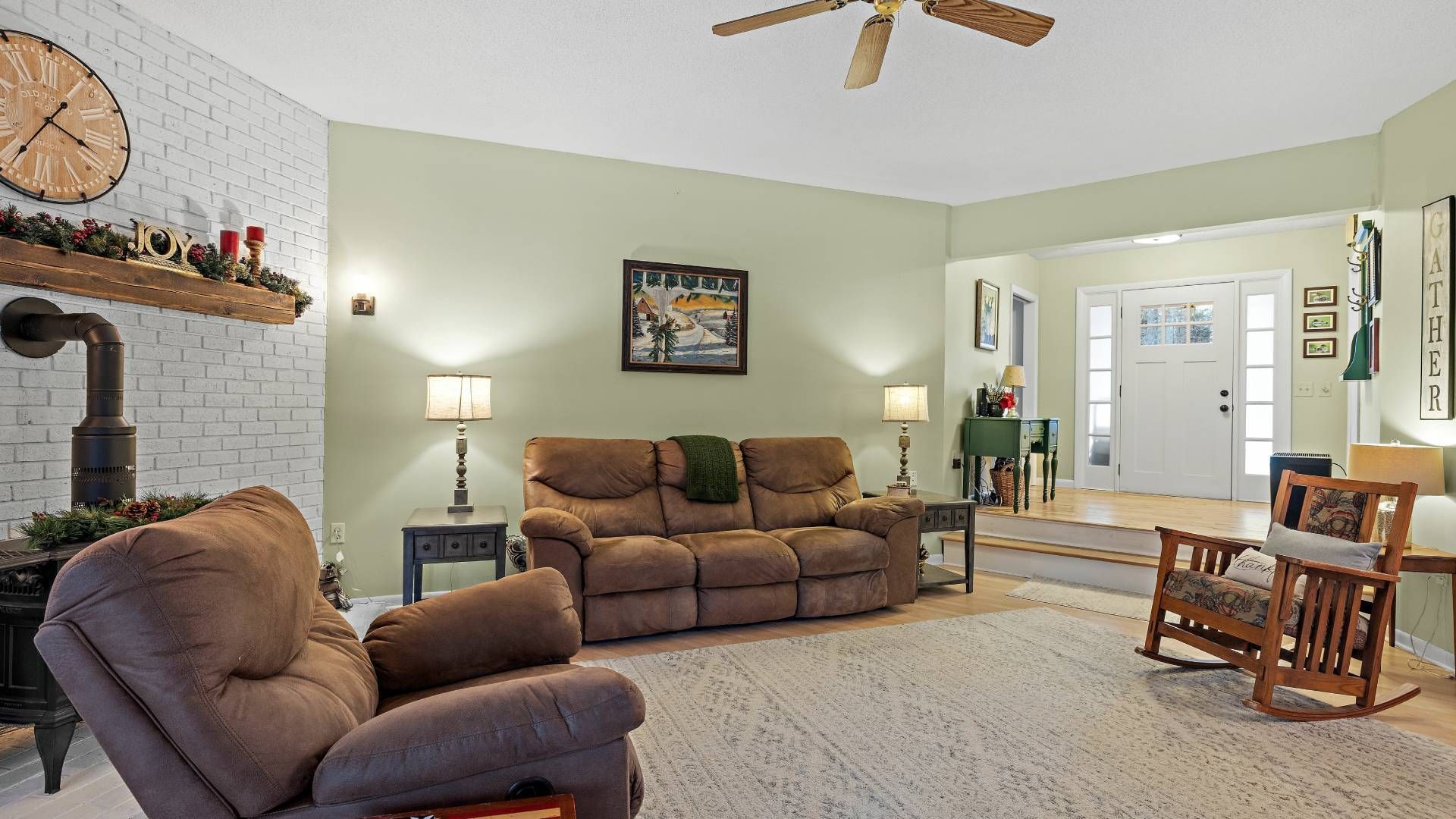 A cozy living room with a raised entryway and sidelight windows at The Blind Guy Kalispell near Flat