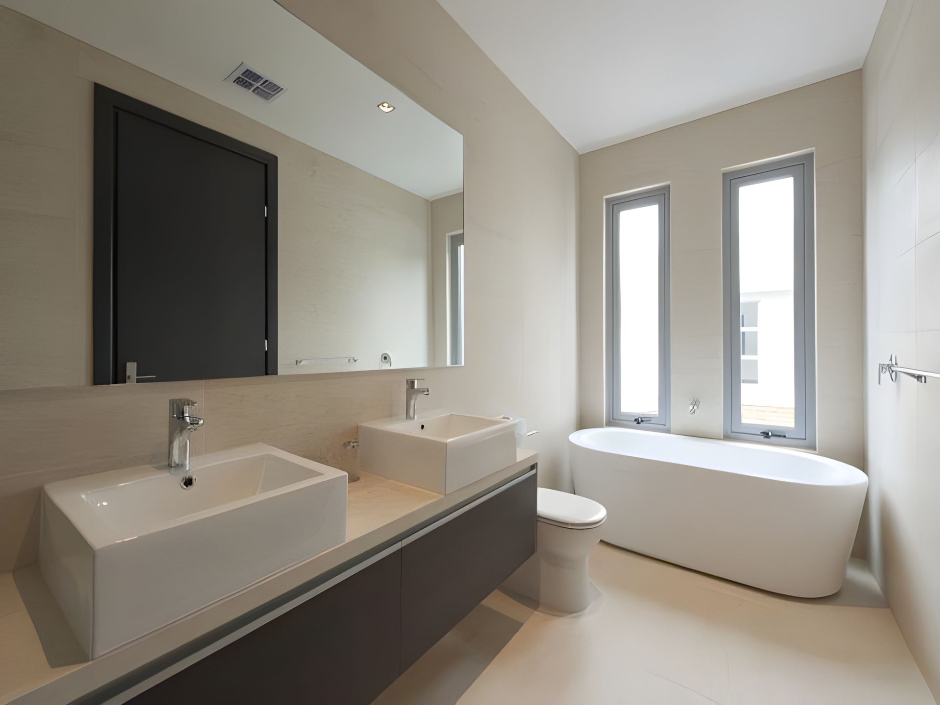 A Bathroom With Two Sinks a Toilet and a Bathtub — Leemark Design Services In Smithfield, QLD