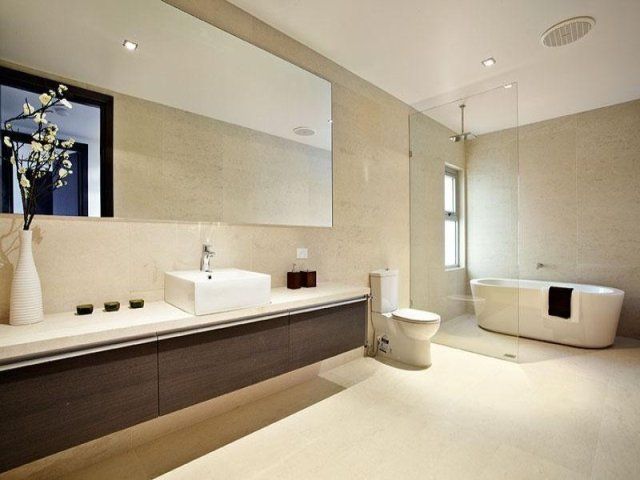 A Bathroom With a Sink a Toilet and a Bathtub — Leemark Design Services In Parramatta Park, QLD