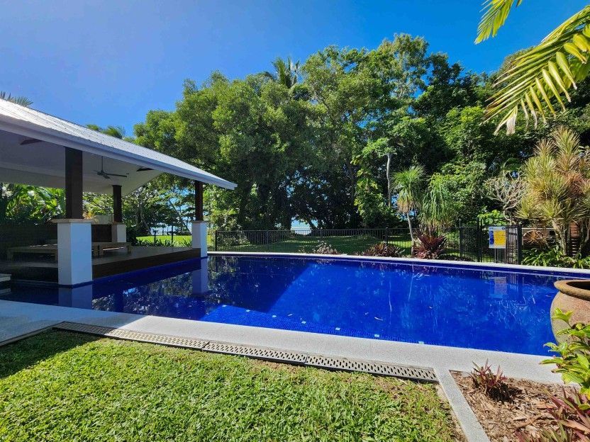 There is a Large Swimming Pool in the Backyard of a House — Leemark Design Services In Parramatta Park, QLD