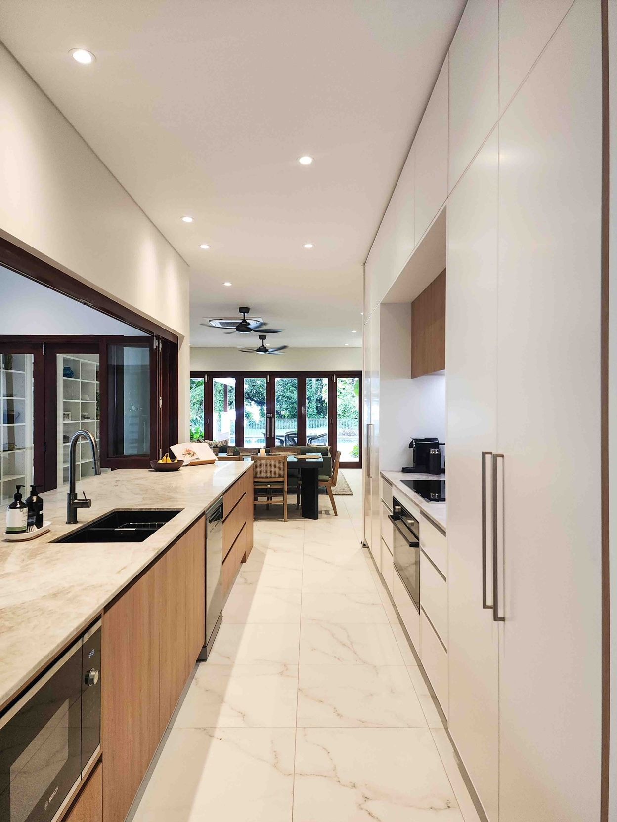 A Room With A Green Exit Sign Above The Door — Leemark Design Services In Parramatta Park, QLD