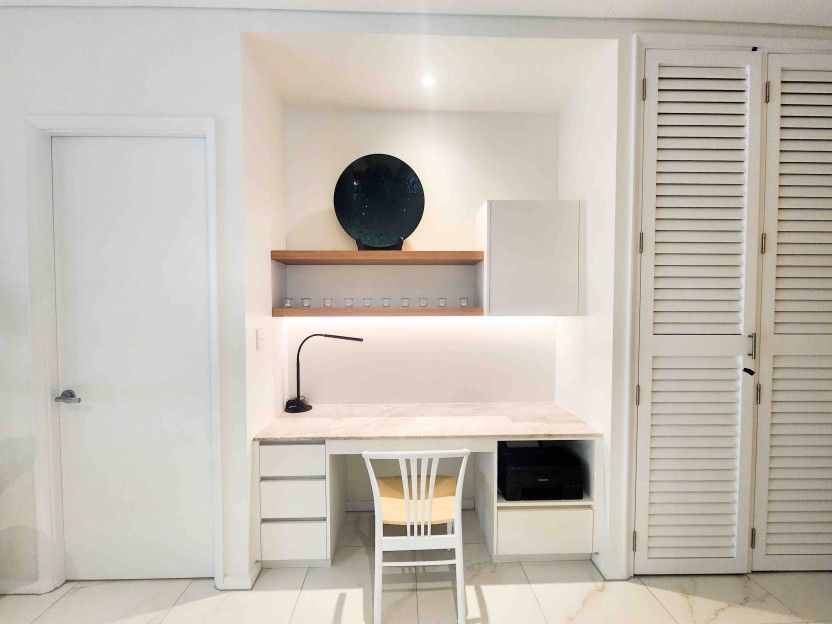 There is a Desk and Chair in the Corner of the Room — Leemark Design Services In Parramatta Park, QLD