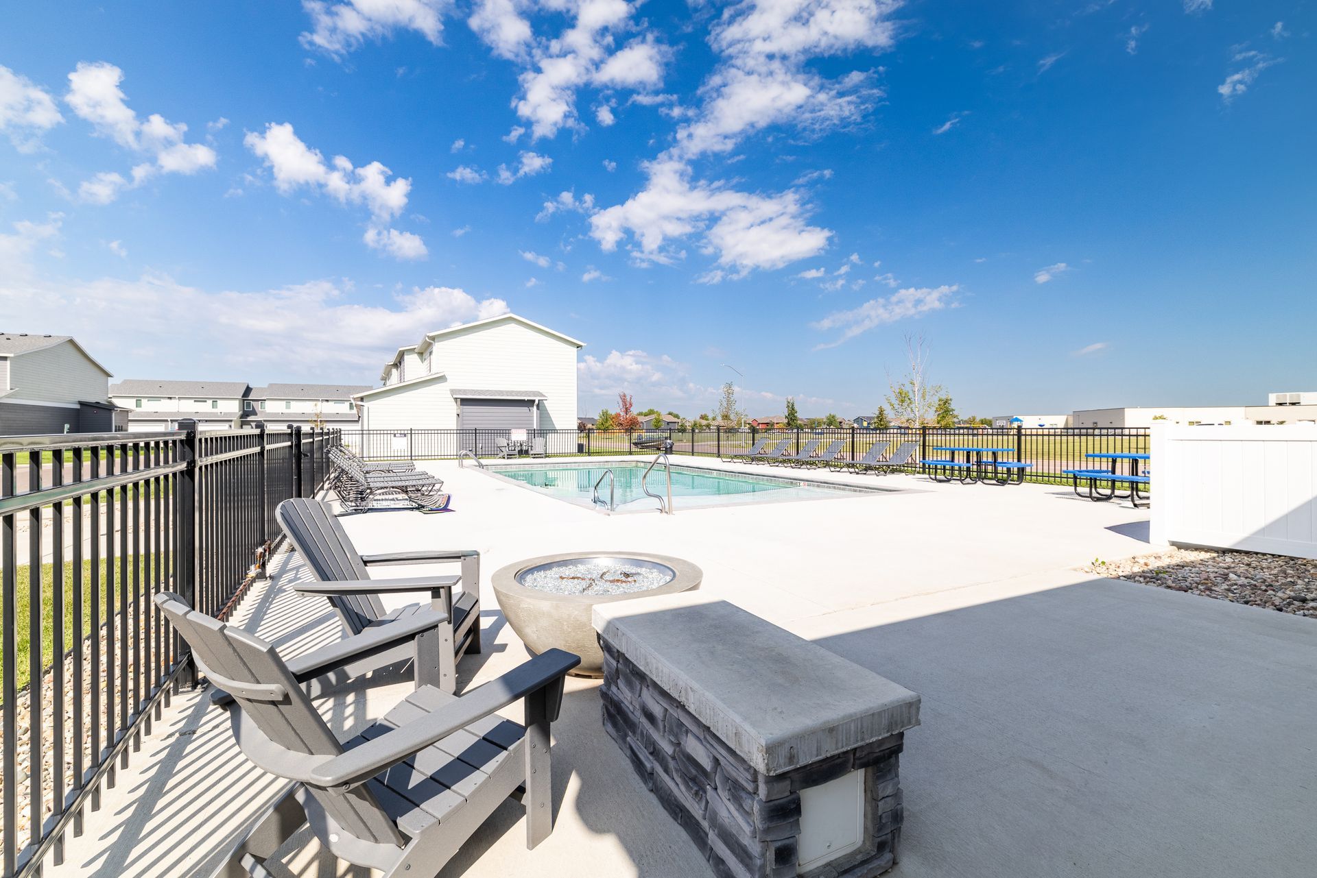 Outdoor fire pit overlooking the pool.