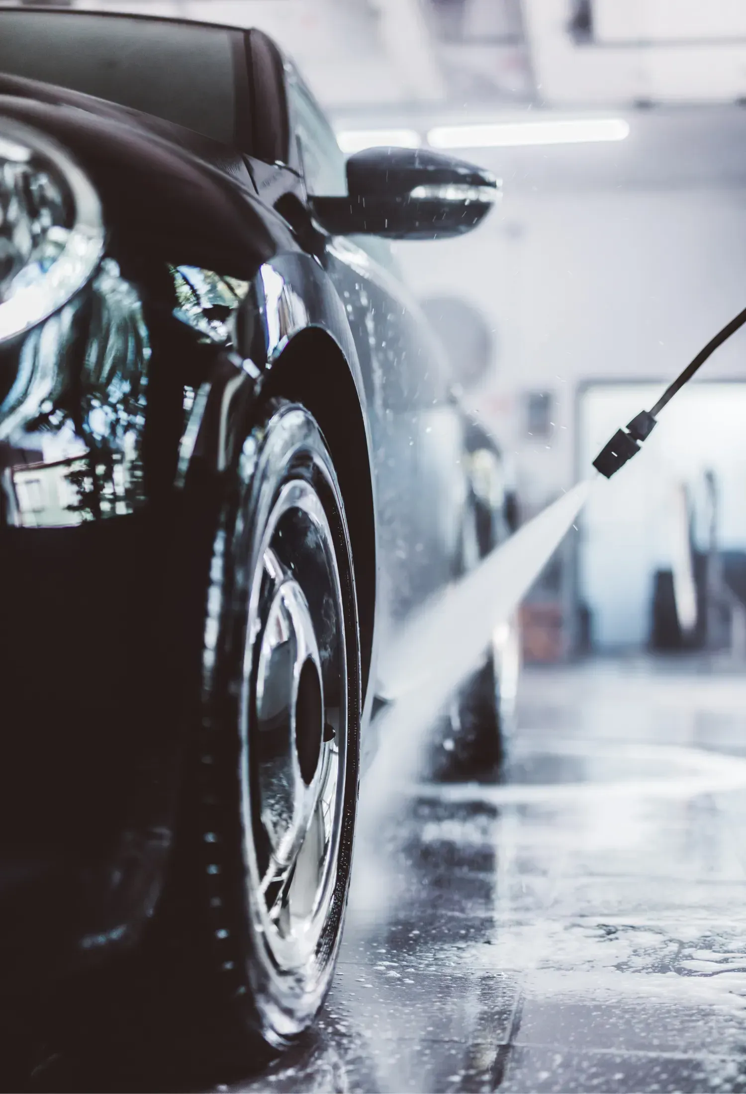 A man is working on an electrical box with a screwdriver.