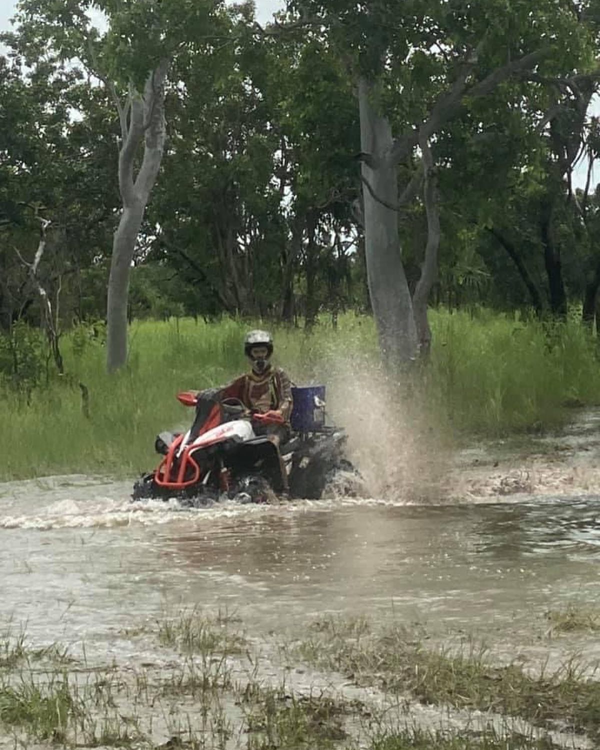 Man driving buggy through water - Parts & Servicing In Yarrawonga, NT