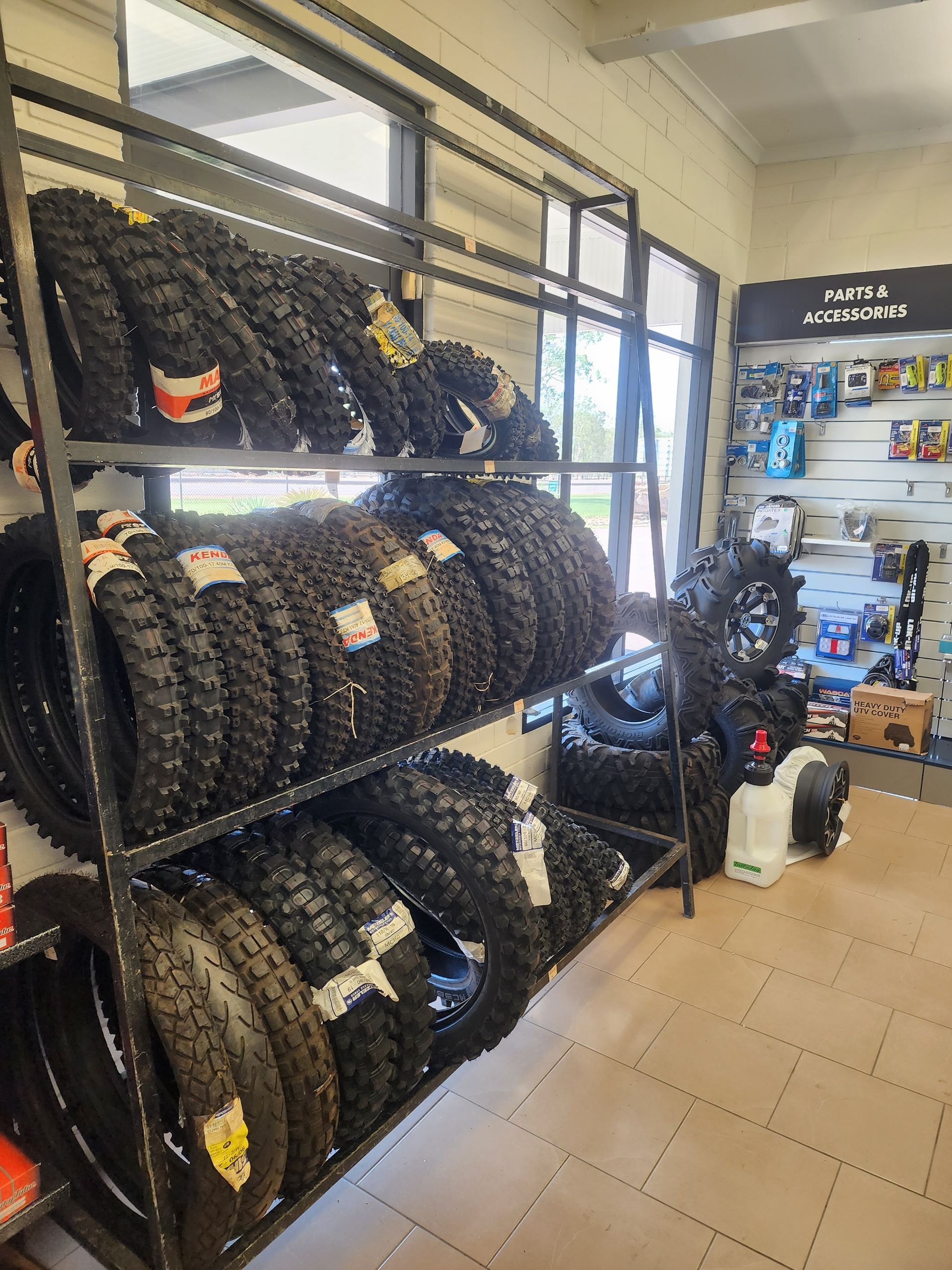 A store filled with lots of tires on shelves.