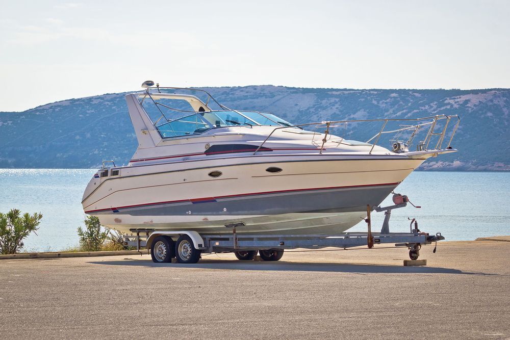 Boat On A Trailer By See - Evinrude Outboard Motor In Tiwi Islands, NT