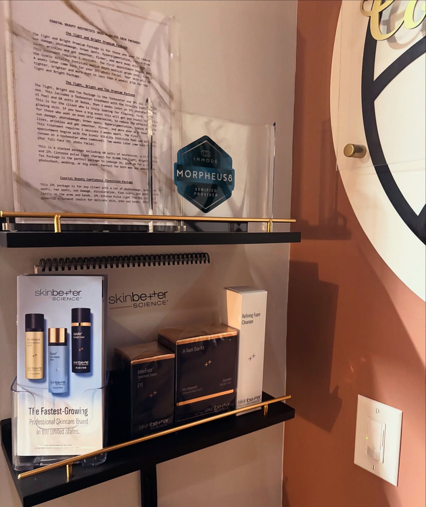 A shelf with a few boxes of cosmetics on it