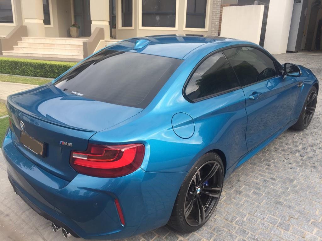 Ceramic tint a white BMW M2 rear view