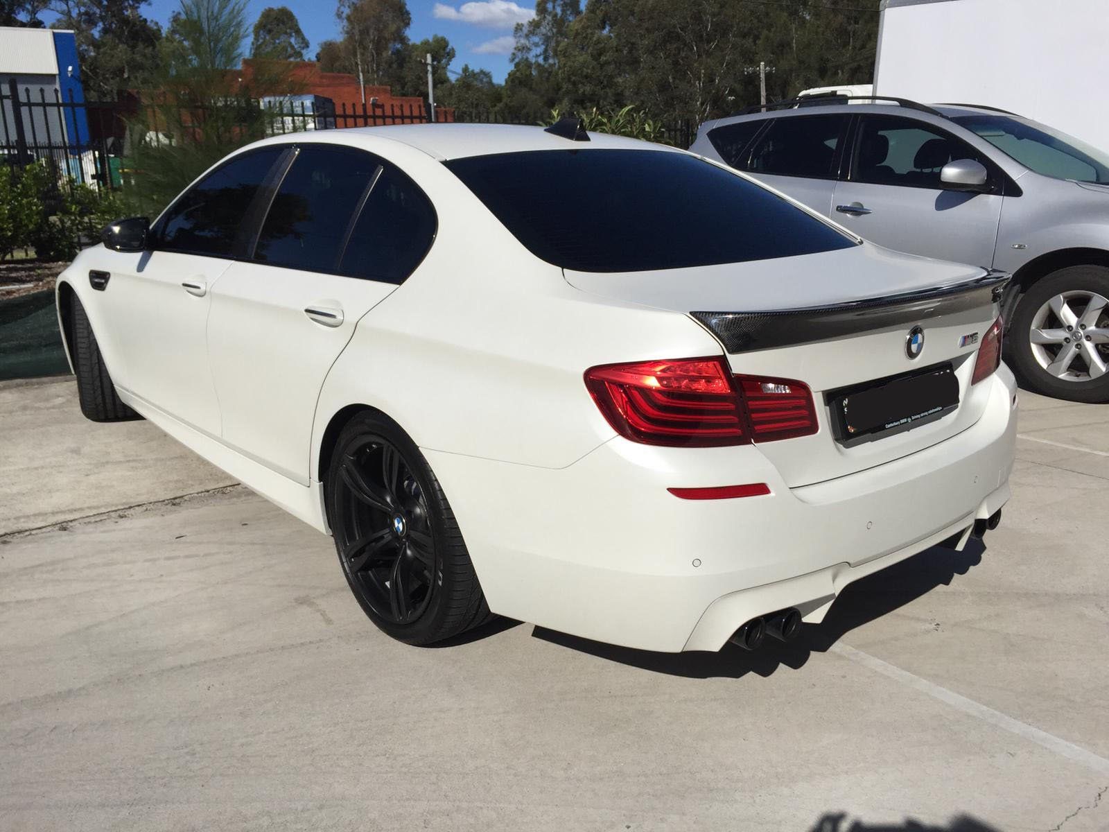 Ceramic tint a white BMW rear side view