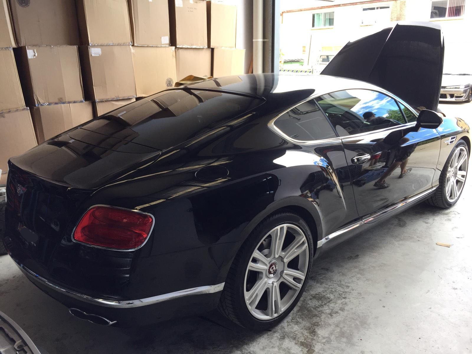 Ceramic tint a black european luxury car rear view