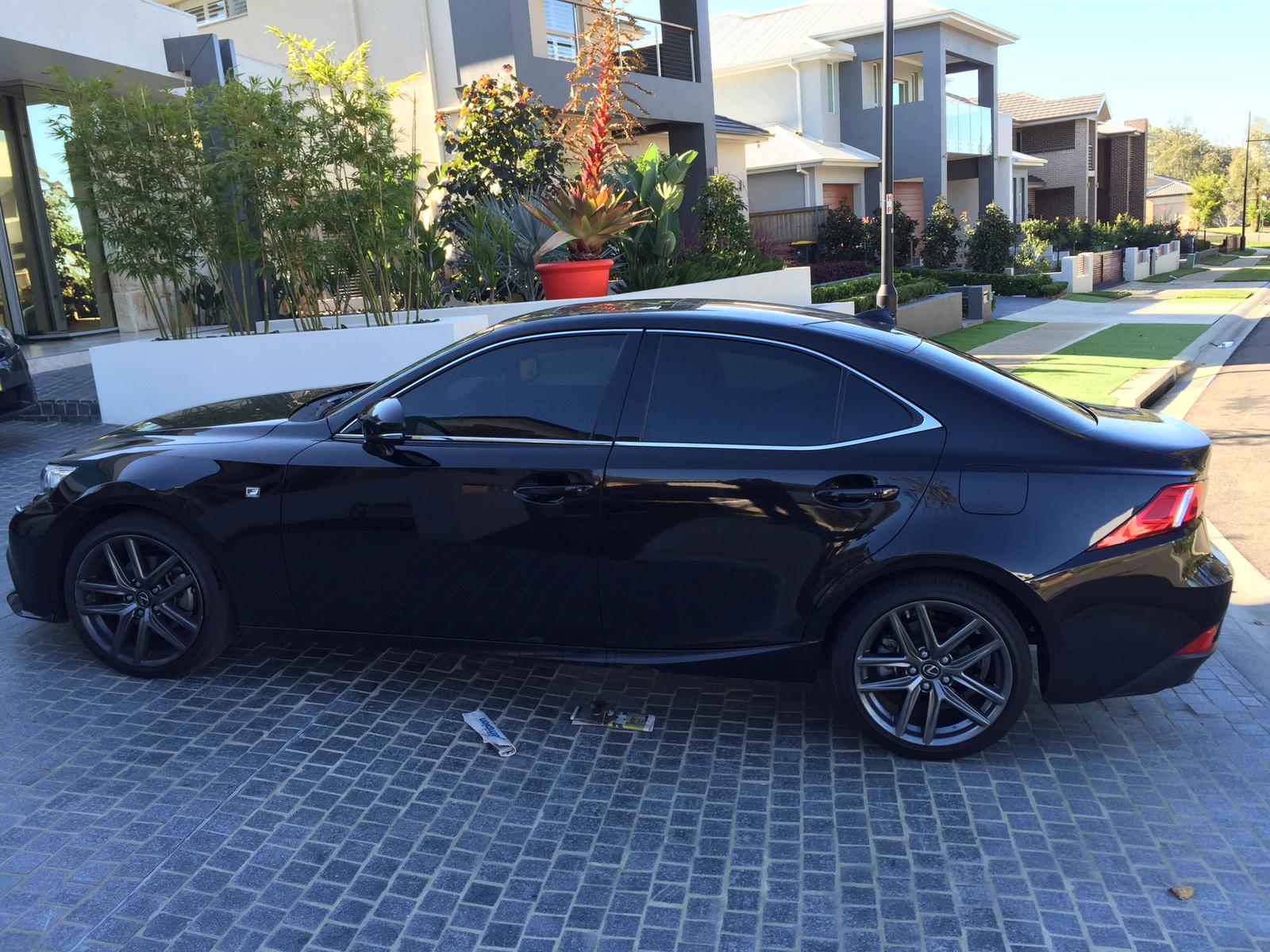 Ceramic tint a black Lexus side view