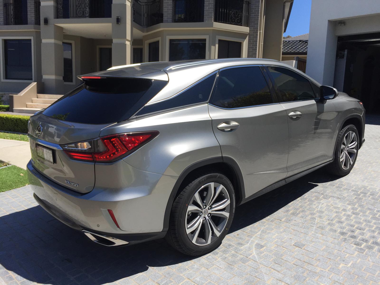 Ceramic tint a black Lexus RX350 rear side view