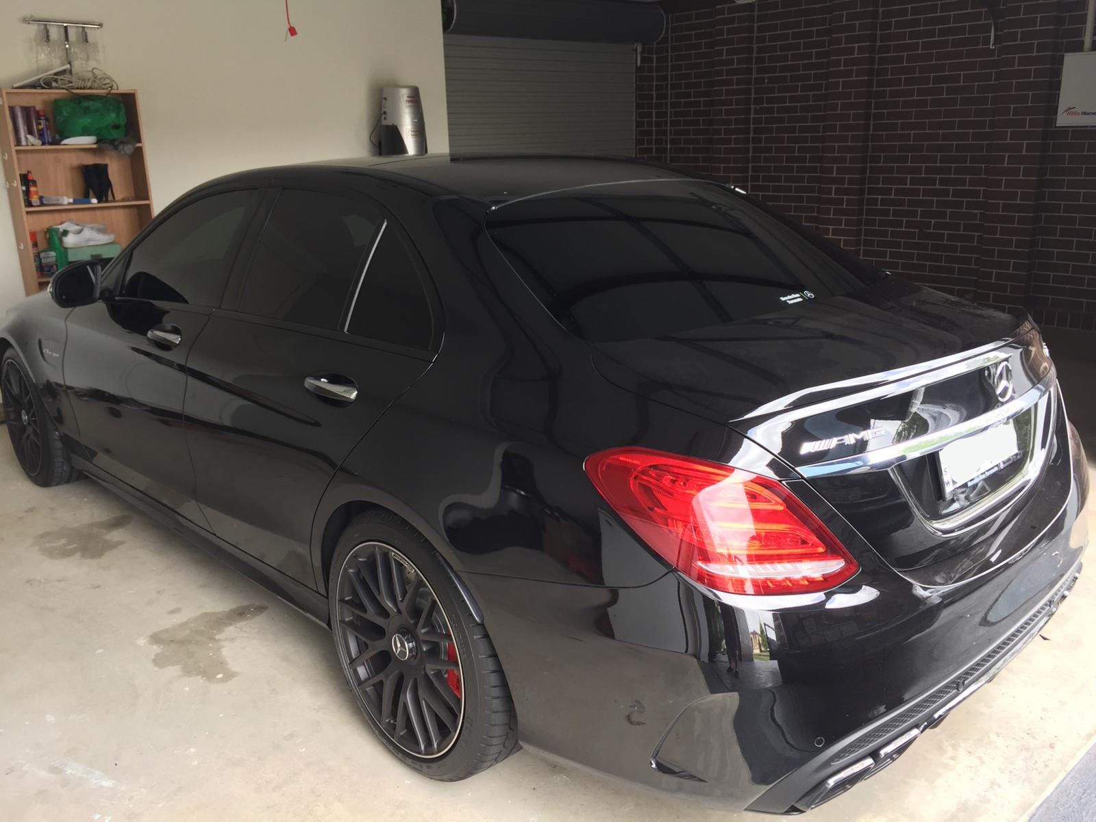 Ceramic tint a black Mercedes luxury rear view 2