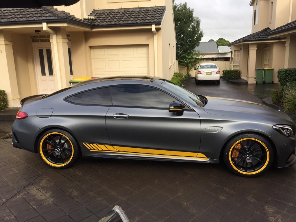 Ceramic tint a grey Mercedes sports c63 side view