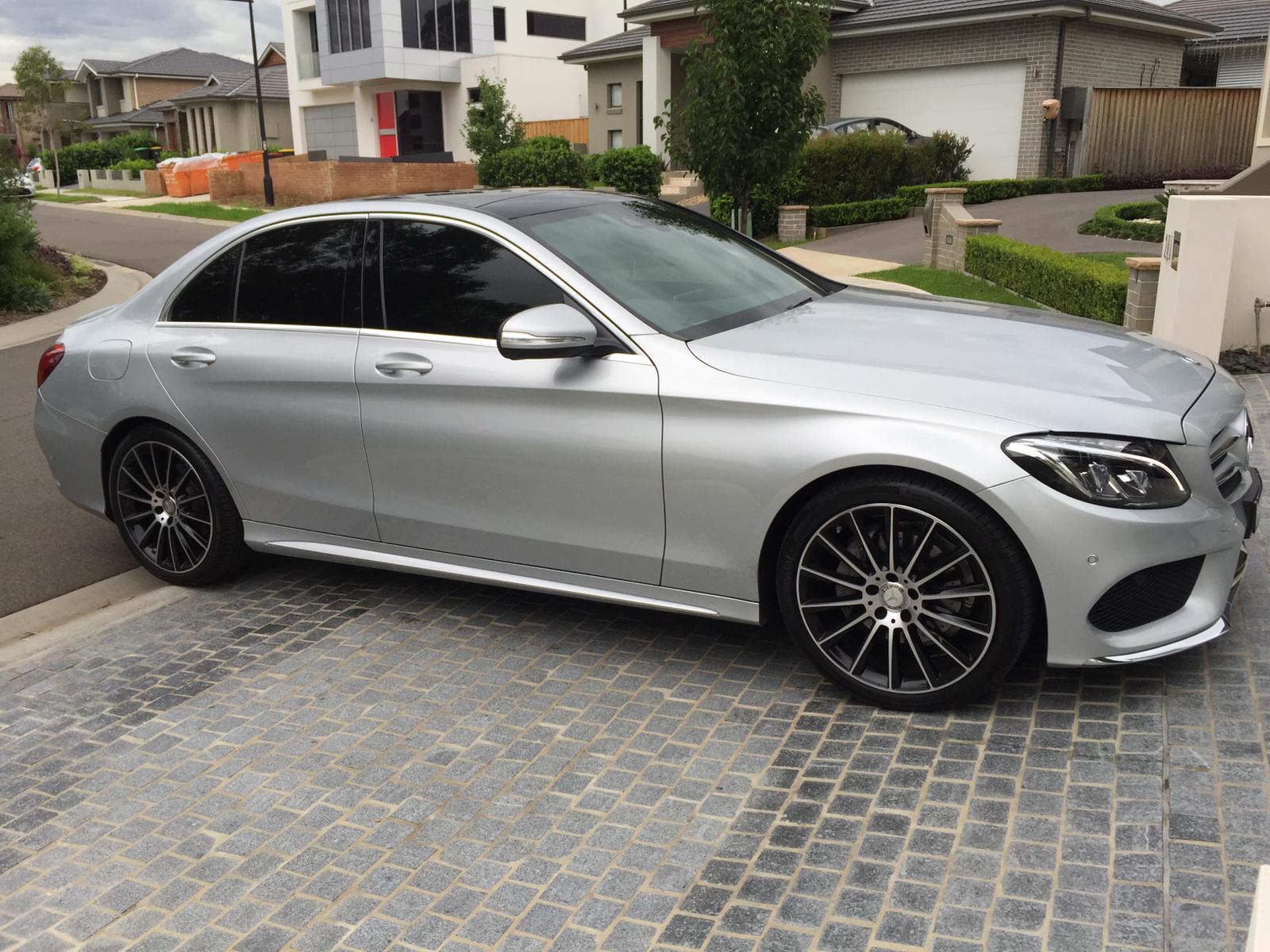 Ceramic tint a silver Mercedes side view