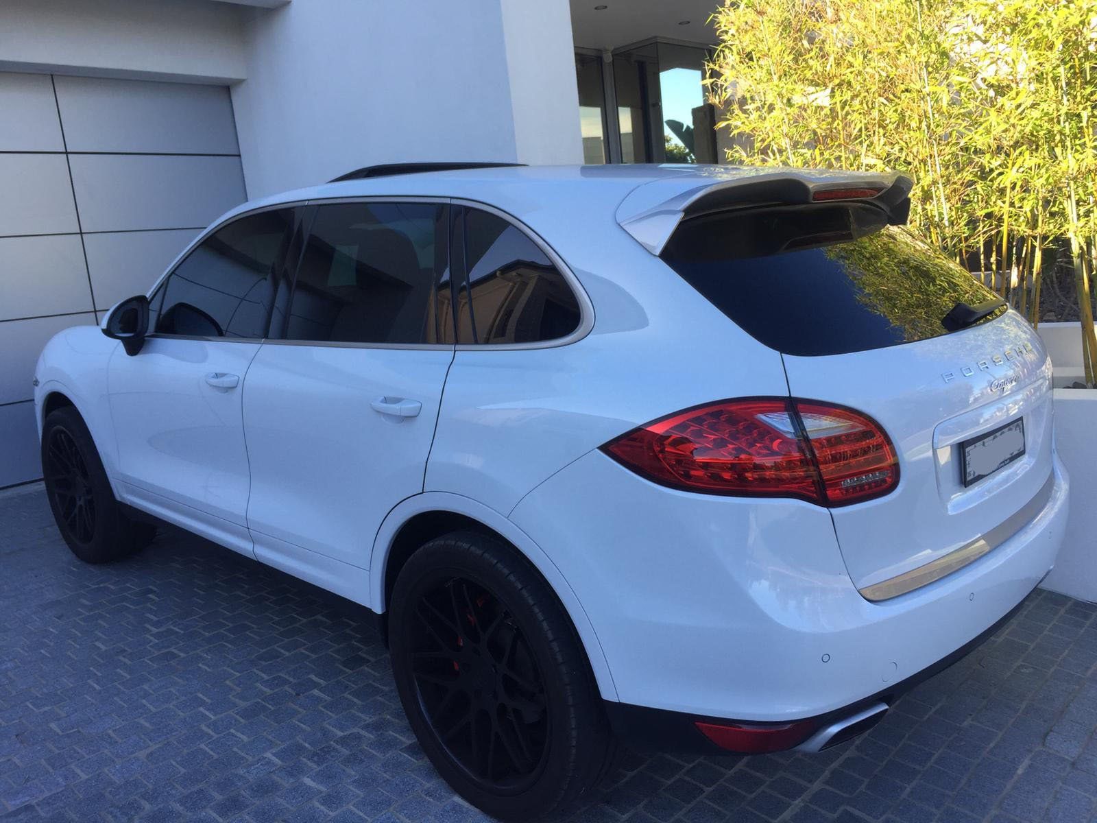 Car tint a white Porsche rear view