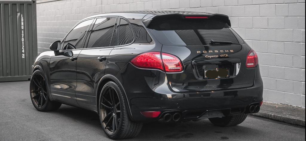 Car tint a black Porsche rear view