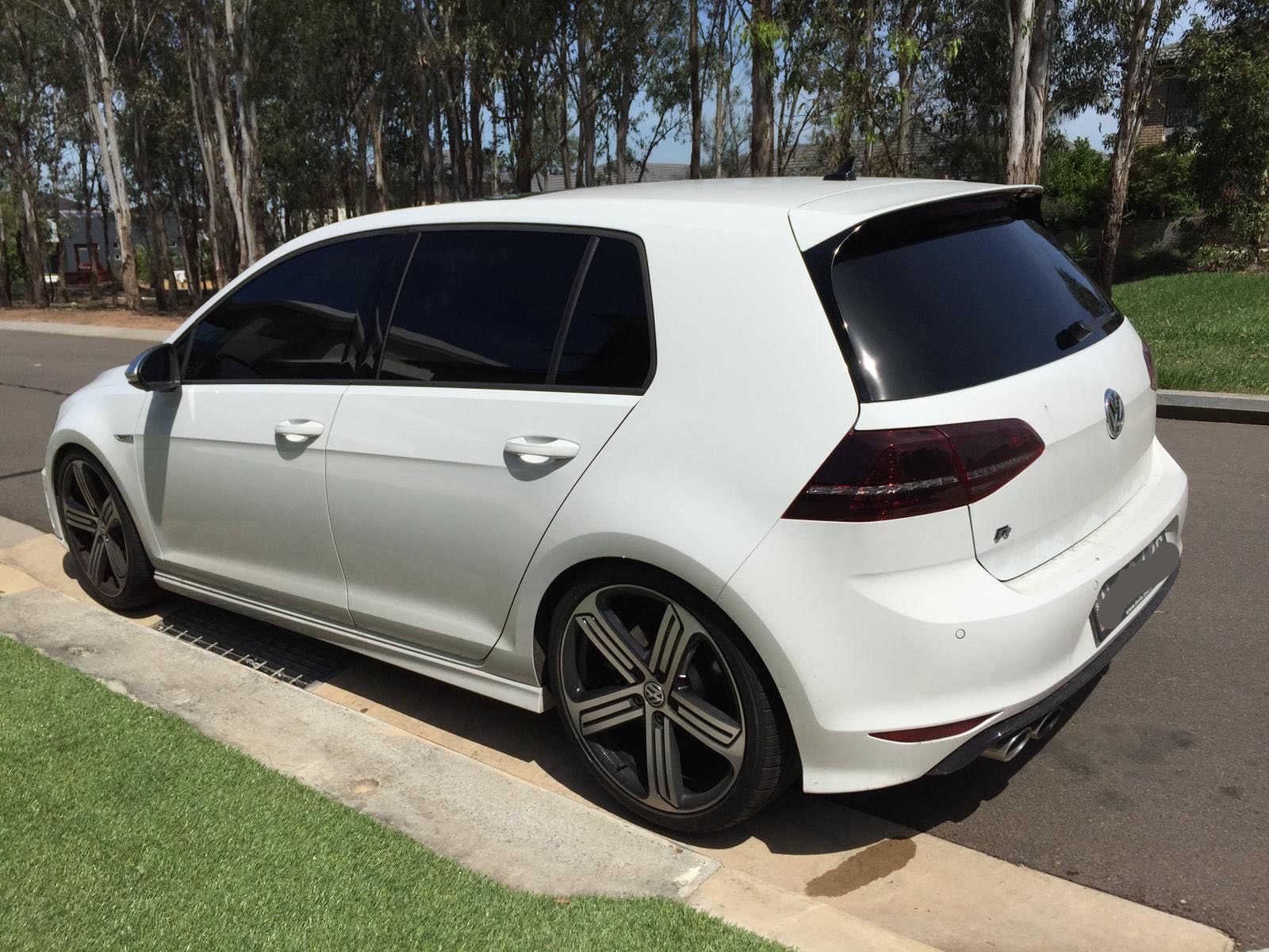 Car tint a white VW Golf side view