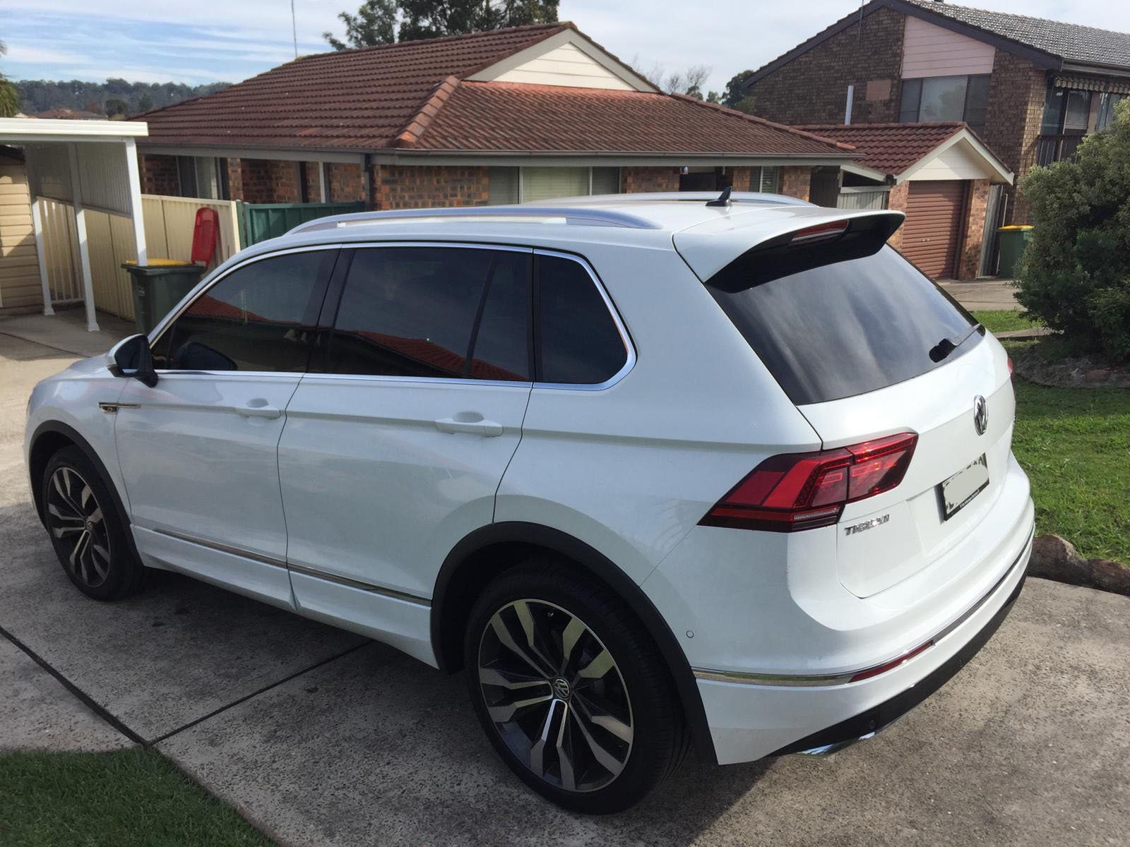 Car tint a white VW Golf rear side view