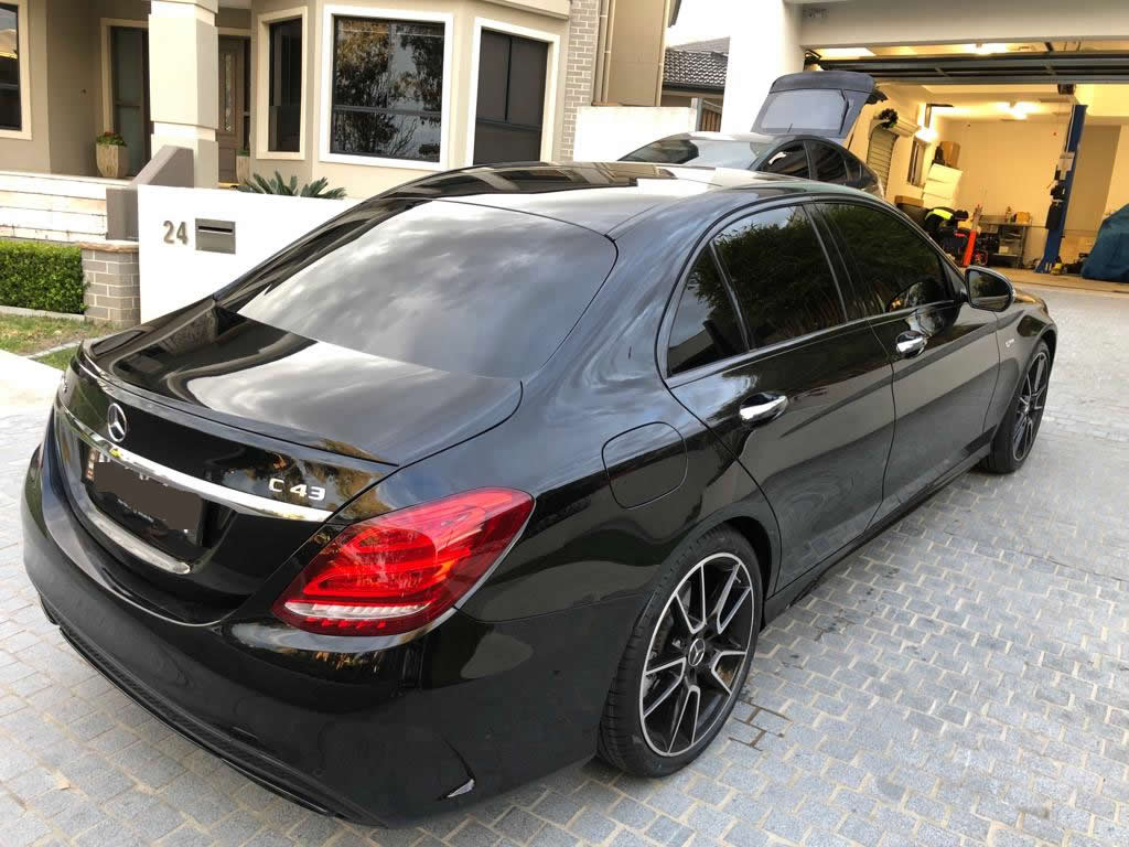 Car tint a black Mercedes rear view