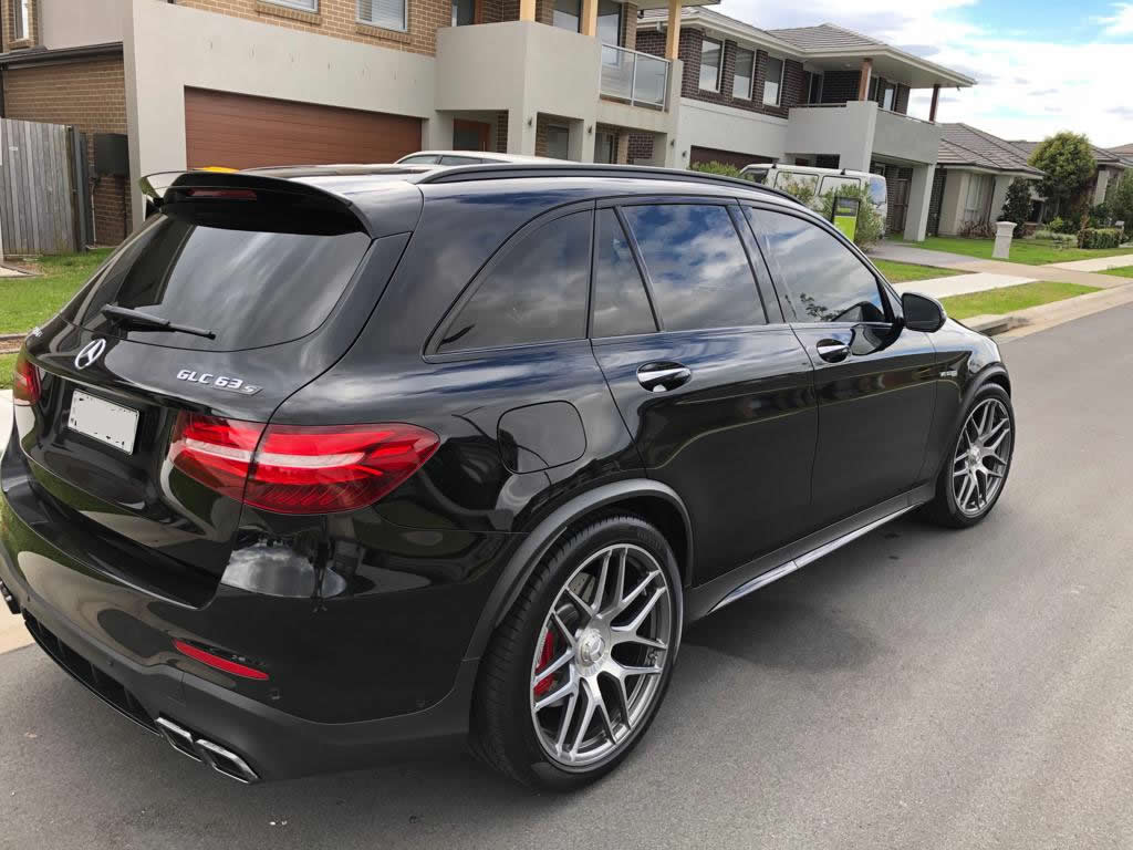 Car tint a black Mercedes 4x4 rear side view