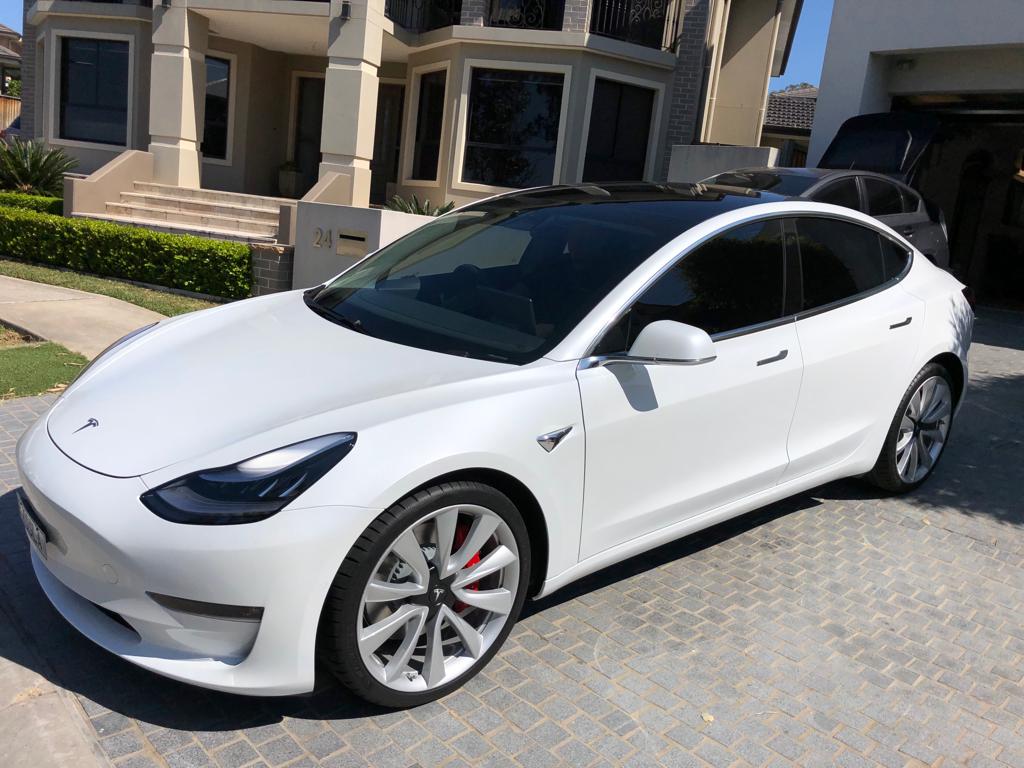 Tint a white Tesla front side view