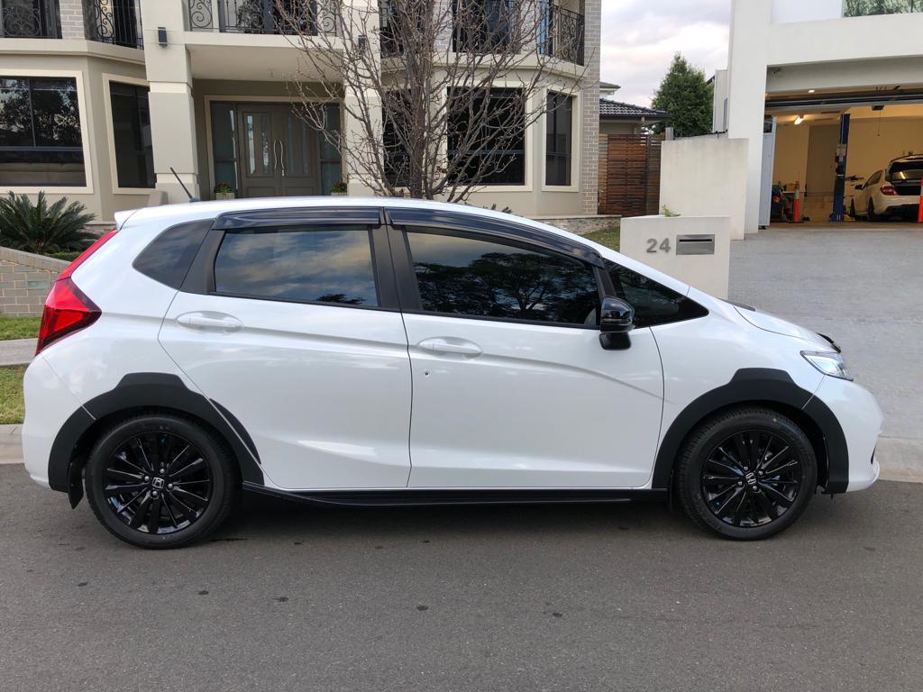 tint a white sedan side view