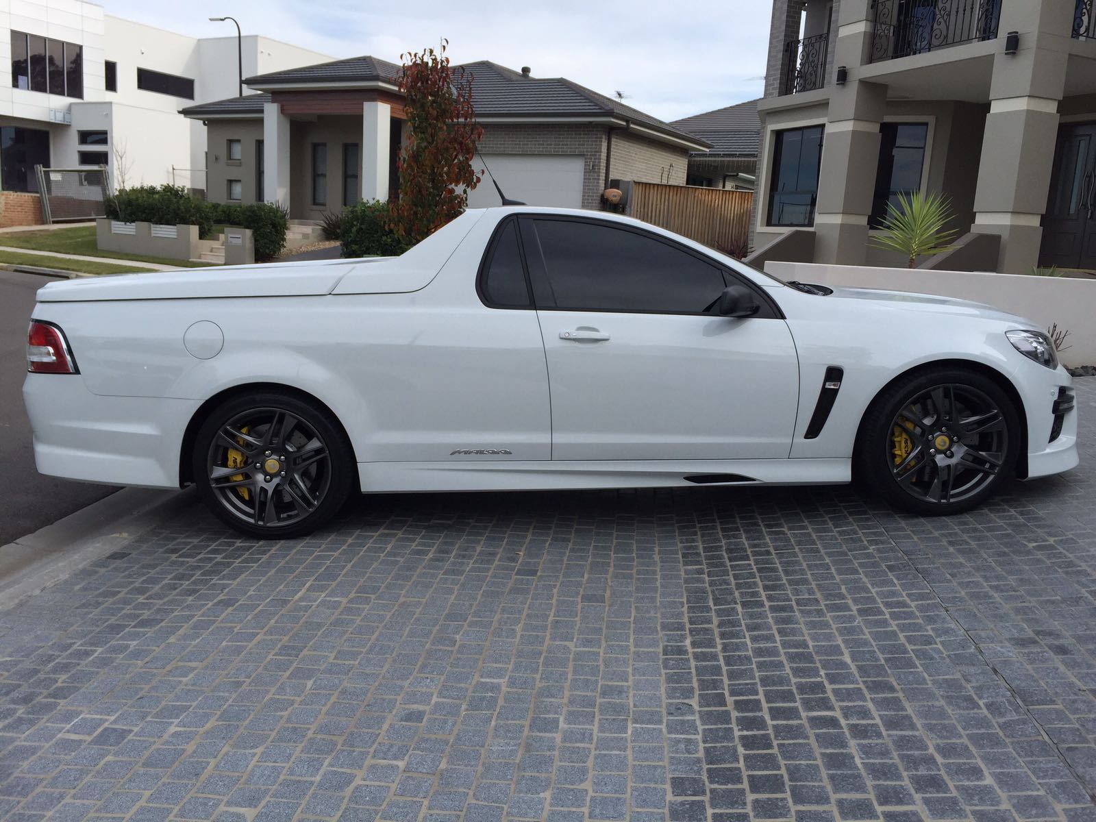 Ceramic tint a white Holden Ute side view