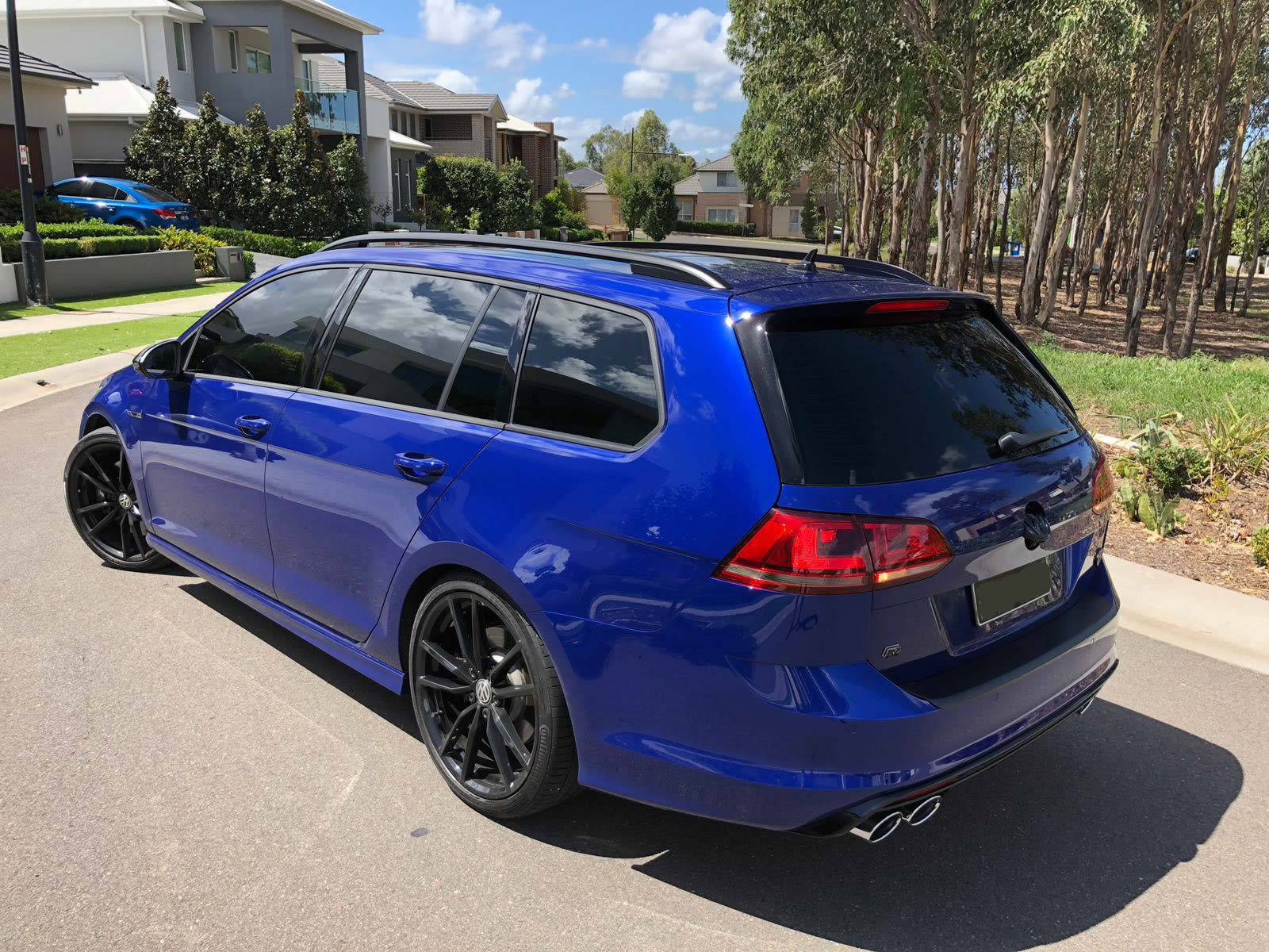 Car tint a blue VW Golf station wagon side view