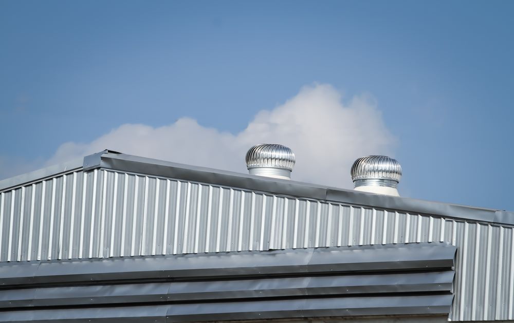 The Roof of a Building With Two Fans on It — Vent Wise in Queanbeyan, NSW