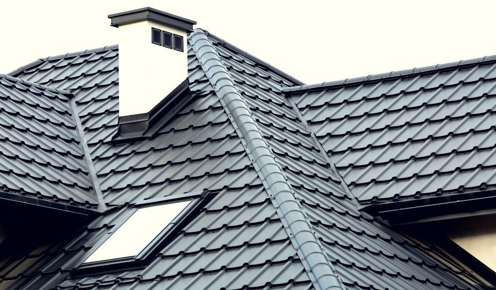 A Roof With a Chimney and a Skylight on It — Vent Wise in Queanbeyan, NSW