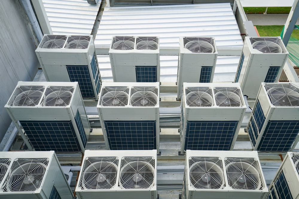 A Bunch of Air Conditioners Are Stacked on Top of Each Other — Vent Wise in Twin Waters, QLD