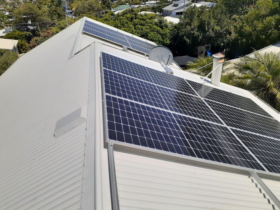Two Solar Panels Are on the Roof of a House — Vent Wise in Twin Waters, QLD