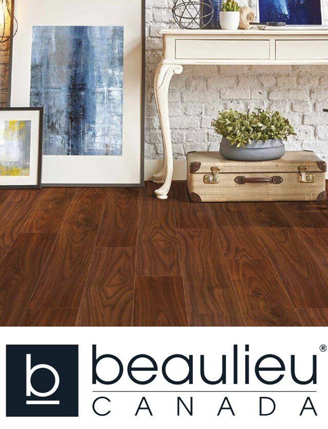 A living room with a wooden floor and a white desk