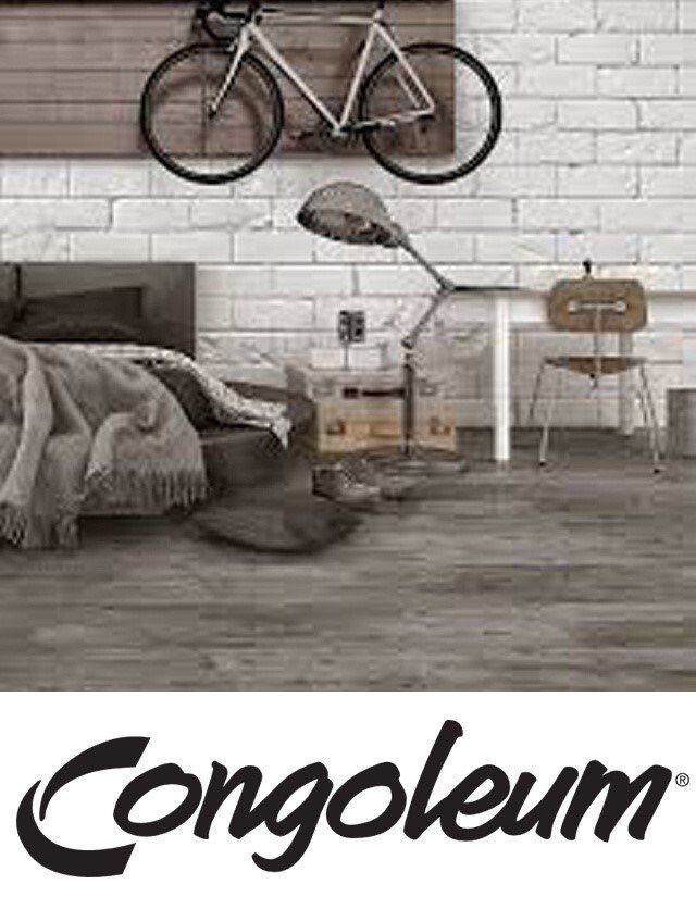 A bedroom with a bicycle hanging on the wall.