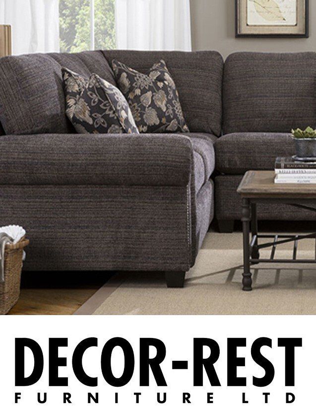 A living room with a couch and a coffee table from decor rest furniture ltd